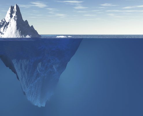 View of Iceberg showing 10% above the water ad 90% blow the surface of the ocean
